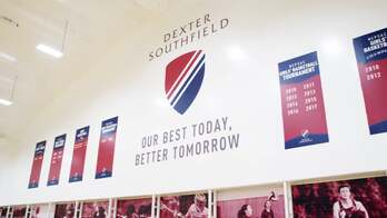Athletic banners hanging in an auditorium
