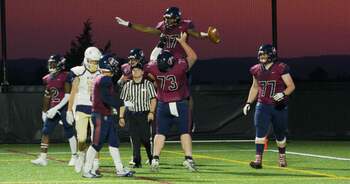 Football players celebrating a touchdown