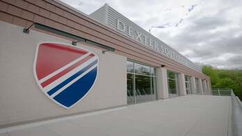 A school building with logo