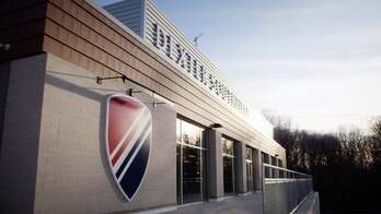 A school building with logo