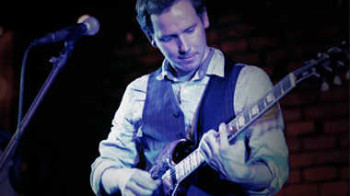 A well-dressed guitarist