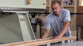 A man milling lumber