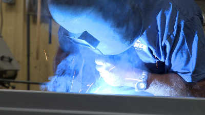 Drone shot of a school amid fall foliage
