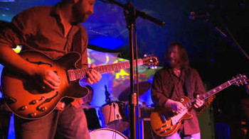 Two guitarists on stage